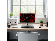 Charger l'image dans la galerie, Un écran de 24 pouces affiche un motif tourbillonnant rouge et noir. Un bureau contient un clavier, une souris et des plantes. Une chaise blanche est devant.