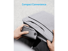 Charger l'image dans la galerie, Batterie externe Anker retirée d'une housse d'ordinateur portable grise. Le texte "Compact Convenience" est visible.