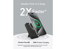 Charger l'image dans la galerie, Un téléphone se chargeant sans fil sur un support. Il affiche un symbole de chargement vert. Texte promouvant la charge rapide.