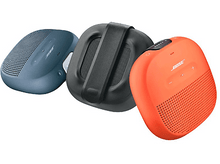 Charger l'image dans la galerie, Trois enceintes colorées : bleu, noir et orange, avec le logo Bose sur chacune.