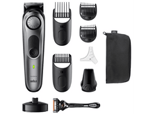 Charger l'image dans la galerie, Un rasoir électrique Braun avec divers accessoires et fixations.