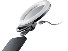 Charger l'image dans la galerie, Une lampe annulaire avec un clip de téléphone fixé à un téléphone. La lumière est blanche avec un clip noir.