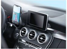 Charger l'image dans la galerie, Un tableau de bord de voiture avec un téléphone affichant une carte et un écran avec des détails de navigation.