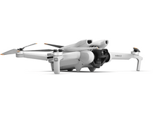 Charger l'image dans la galerie, Un drone blanc, face à gauche, avec ses hélices déployées.