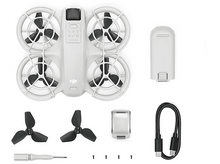 Charger l'image dans la galerie, Un drone DJI blanc avec des accessoires sur une surface blanche.
