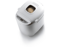 Charger l'image dans la galerie, Machine à pain blanche avec un pain à l'intérieur. Sur une surface blanche.