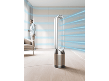 Charger l'image dans la galerie, Ventilateur Dyson blanc et doré avec un homme regardant par une fenêtre.