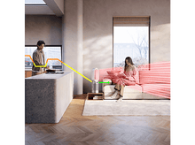 Charger l'image dans la galerie, Une femme assise sur un canapé avec un ventilateur.