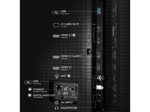 Charger l'image dans la galerie, Un gros plan des ports à l'arrière d'un téléviseur noir.
