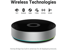 Charger l'image dans la galerie, Un appareil noir et circulaire avec divers symboles de technologie sans fil sur le dessus.