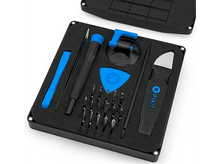 Charger l'image dans la galerie, Trousse à outils iFixit ouverte, outils organisés dans de la mousse noire. Tournevis, pinces et ventouse visibles.