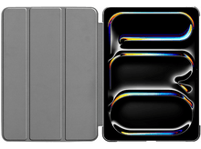 Charger l'image dans la galerie, Une tablette avec un étui, ouverte pour montrer l'écran, affichant un design abstrait coloré.