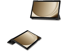 Charger l'image dans la galerie, Deux étuis de tablette avec tablette à l'intérieur. Étuis noirs avec intérieur et écran dorés.