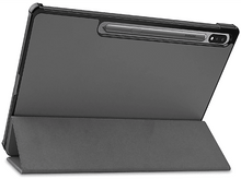 Charger l'image dans la galerie, Une tablette grise avec une bordure sombre, reposant sur un support. Un stylet est dans la fente supérieure.