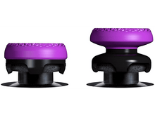 Charger l'image dans la galerie, Deux extensions de joystick violettes et noires sur une surface blanche.
