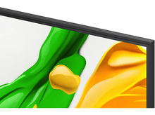 Charger l'image dans la galerie, Gros plan sur le coin d'un écran de télévision. De la peinture abstraite verte et jaune est affichée.