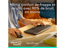 Charger l'image dans la galerie, Un homme utilise un clavier et une souris. Clavier sur une table en bois.