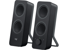 Charger l'image dans la galerie, Deux enceintes noires avec un bouton de volume et une lumière verte à droite.