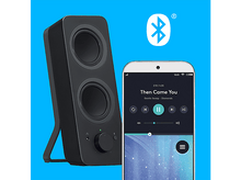 Charger l'image dans la galerie, Un haut-parleur noir et un smartphone diffusant de la musique. Icône Bluetooth en haut à droite. Fond bleu.