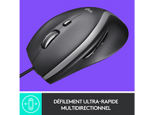 Charger l'image dans la galerie, Une souris d'ordinateur noire et argentée avec une molette, sur fond violet.