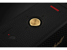 Charger l'image dans la galerie, Gros plan d'un haut-parleur noir avec un bouton doré et une lumière LED rouge.