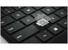 Charger l'image dans la galerie, Gros plan sur un clavier avec une touche enlevée, mécanisme interne.