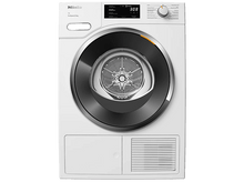 Charger l'image dans la galerie, Un sèche-linge Miele blanc avec une porte noire et argentée. Il affiche 3:08 sur l'écran numérique. Panneau de commande à droite.