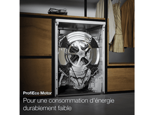 Charger l'image dans la galerie, Intérieur de la machine à laver. Le tambour, le moteur et les pièces sont visibles.