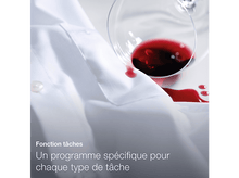 Charger l'image dans la galerie, Une chemise blanche avec une tache de vin rouge et un verre.
