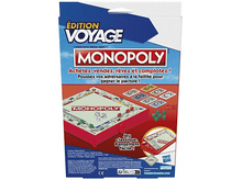 Charger l'image dans la galerie, Une boîte de jeu de société Monopoly avec du texte et un plateau visible, code couleur rouge et bleu.
