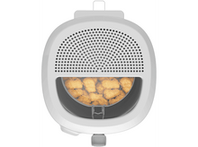 Charger l'image dans la galerie, Une vue aérienne d'une friteuse blanche remplie de pépites de poulet dorées.