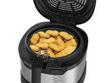 Charger l'image dans la galerie, Une friteuse à air Moulinex Uno ouverte avec des nuggets dans le panier.