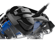 Charger l'image dans la galerie, Gros plan sur la partie supérieure d'une manette de jeu noire et transparente avec les boutons R1 et R2.