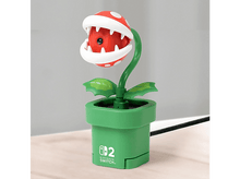 Charger l'image dans la galerie, Une webcam Piranha Plant dans un pot vert avec un logo Nintendo Switch.
