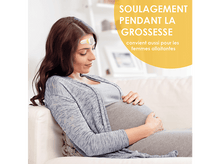 Charger l'image dans la galerie, Femme enceinte assise sur un canapé, avec un thermomètre sur le front.