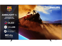 Charger l'image dans la galerie, Un écran de télévision affichant une scène de train avec des personnes au-dessus, avec le logo Philips et Ambilight visible.