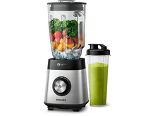 Charger l'image dans la galerie, Un blender Philips avec un bocal en verre rempli de fruits et de glace. Un gobelet séparé contient un smoothie vert.
