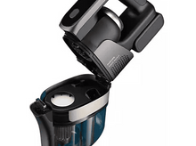 Charger l'image dans la galerie, Un aspirateur noir et argent est ouvert, montrant les composants internes.