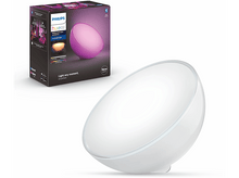 Charger l'image dans la galerie, Une lampe Philips Hue blanche et violette. La boîte est à l'arrière-plan. La lampe est sur une surface blanche.