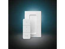 Charger l'image dans la galerie, Télécommande et base Philips Hue blanches. Boutons sur la télécommande, base carrée.