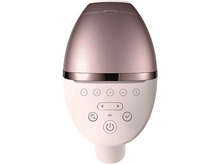Charger l'image dans la galerie, Un appareil rose et or rose avec des boutons et un bouton d'alimentation. Fond blanc.