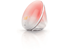 Charger l'image dans la galerie, Lampe de réveil Philips, lumière orange émise de l'intérieur. Base blanche, fond blanc et reflet.