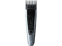 Charger l'image dans la galerie, Tondeuse à cheveux bleue et grise avec réglages numérotés et une lumière verte.