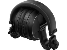 Charger l'image dans la galerie, Casque circum-auriculaire noir, plié et posé sur une surface. Marque Pioneer DJ.