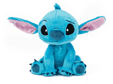 Charger l'image dans la galerie, Une peluche bleue de Stitch, assise. Il a de grands yeux et oreilles.
