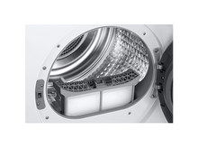Charger l'image dans la galerie, La porte du sèche-linge ouverte révèle le filtre. Le cadre du filtre gris contient deux écrans filtrants blancs. L'intérieur du tambour est argenté.