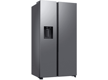 Charger l'image dans la galerie, Un réfrigérateur gris en studio, isolé sur fond blanc. Il a un distributeur d'eau.