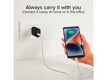 Charger l'image dans la galerie, Un chargeur noir est branché sur une prise murale, chargeant un téléphone à 70 %.