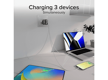 Charger l'image dans la galerie, Un chargeur avec trois câbles branchés au mur. Appareils en charge : ordinateur portable, tablette et téléphone.