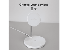 Charger l'image dans la galerie, Une station de charge blanche sur une table avec un fond blanc.